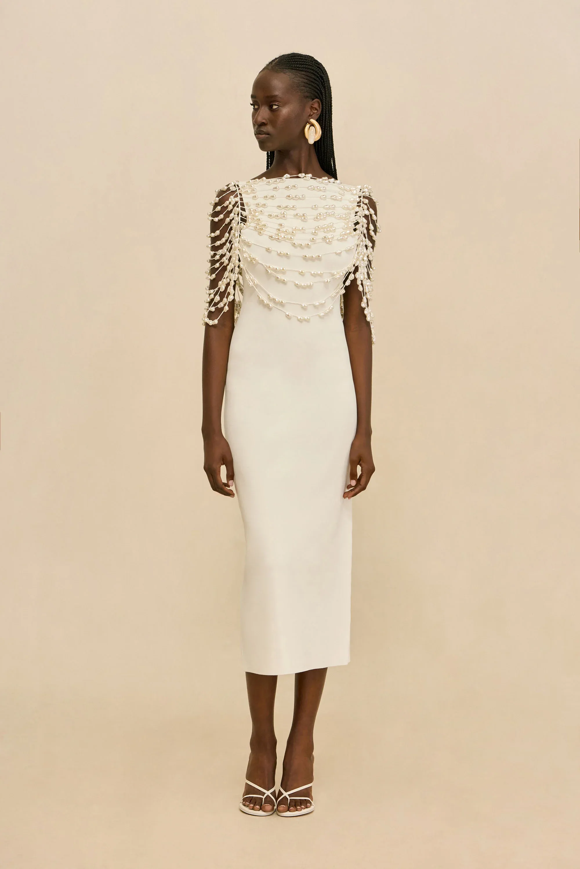Cult Gaia white midi dress with white pearls on strings hanging off the shoulders